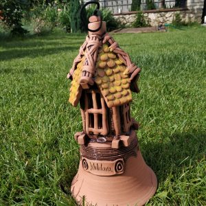 Pottery souvenir handicrafts bell with yellow roof house on it