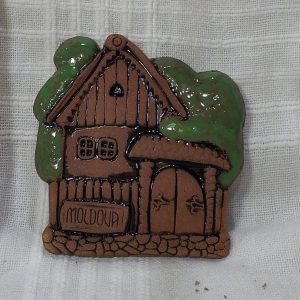 Pottery souvenir green roof house
